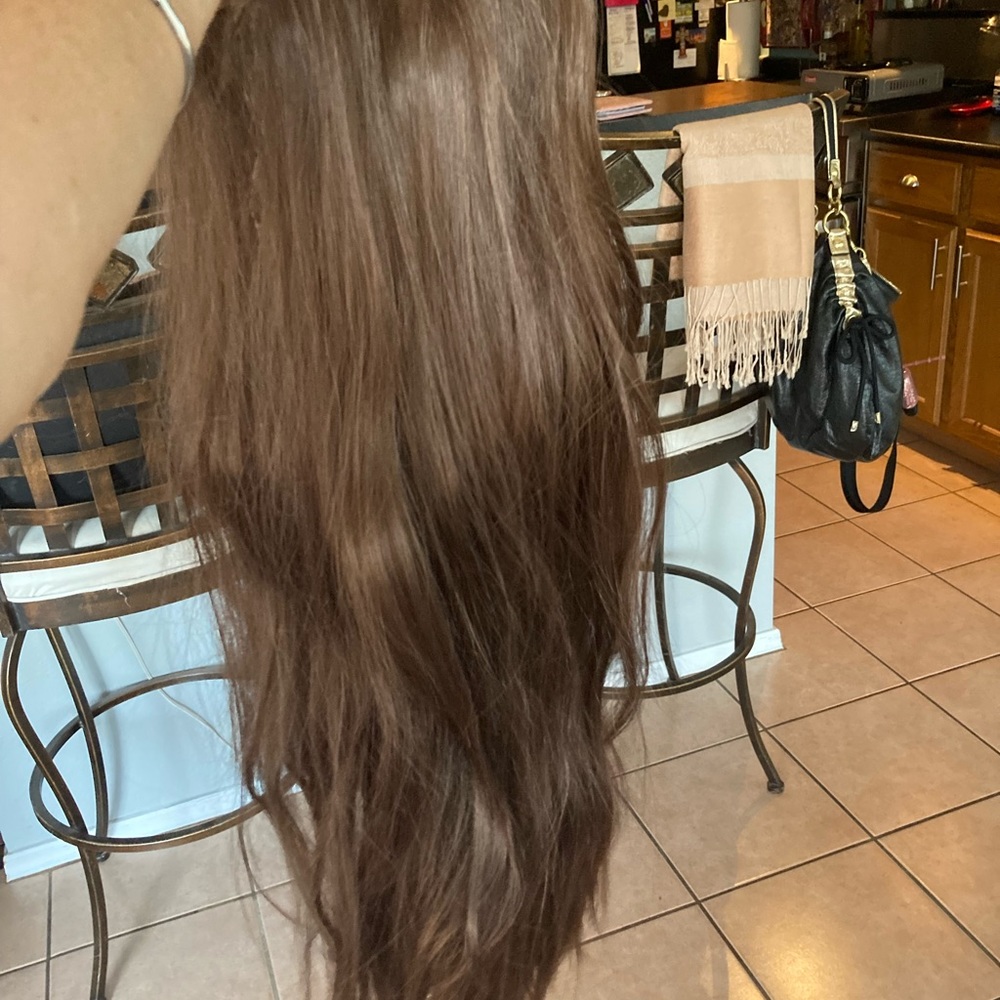 Long, silky soft brownish-blond wig.